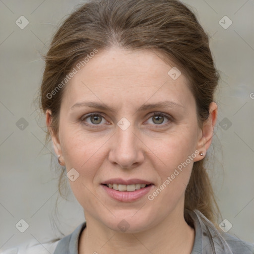 Joyful white adult female with medium  brown hair and grey eyes