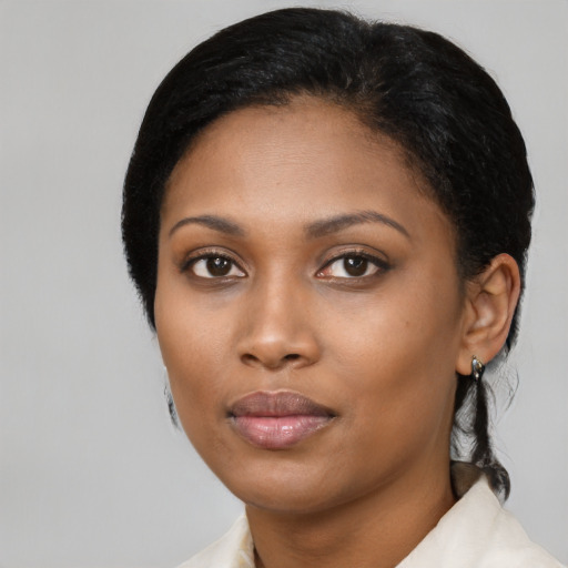 Neutral black young-adult female with medium  black hair and brown eyes