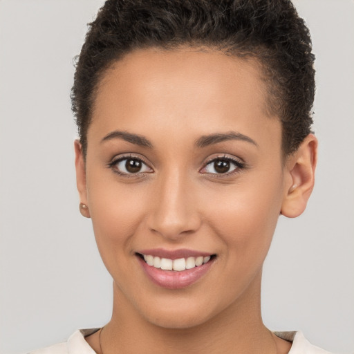 Joyful white young-adult female with short  brown hair and brown eyes