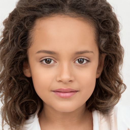 Joyful white child female with long  brown hair and brown eyes