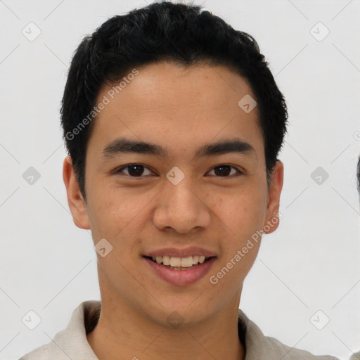 Joyful latino young-adult male with short  black hair and brown eyes