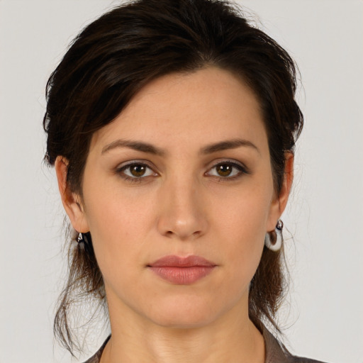 Neutral white young-adult female with medium  brown hair and brown eyes