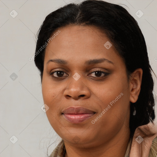 Joyful black young-adult female with short  brown hair and brown eyes