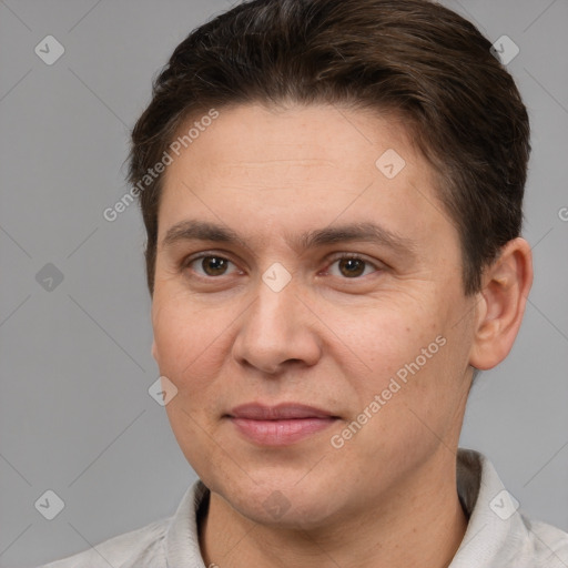 Joyful white adult male with short  brown hair and brown eyes