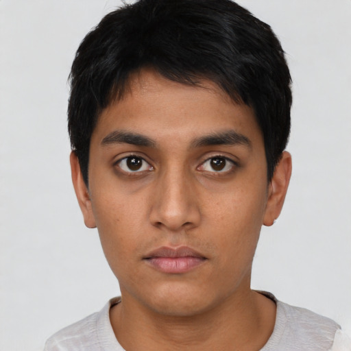 Neutral latino young-adult male with short  black hair and brown eyes