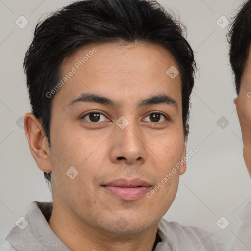 Joyful latino young-adult male with short  brown hair and brown eyes