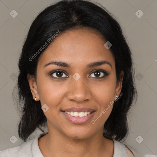 Joyful black young-adult female with medium  black hair and brown eyes