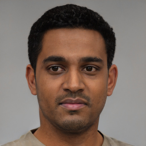 Neutral black young-adult male with short  black hair and brown eyes