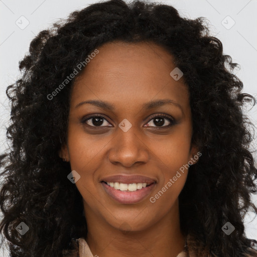 Joyful black young-adult female with long  brown hair and brown eyes