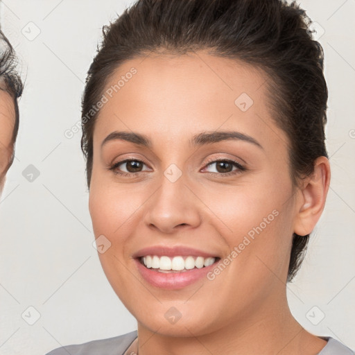 Joyful white young-adult female with short  brown hair and brown eyes