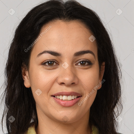 Joyful latino young-adult female with long  brown hair and brown eyes