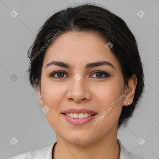 Joyful latino young-adult female with medium  brown hair and brown eyes