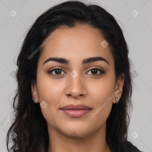 Joyful latino young-adult female with long  brown hair and brown eyes