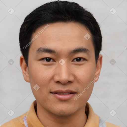 Joyful asian young-adult male with short  black hair and brown eyes