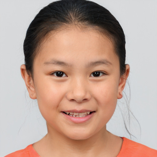 Joyful white child female with short  brown hair and brown eyes