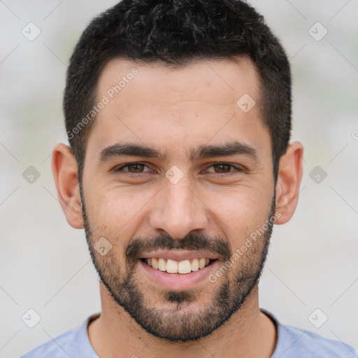 Joyful white young-adult male with short  black hair and brown eyes