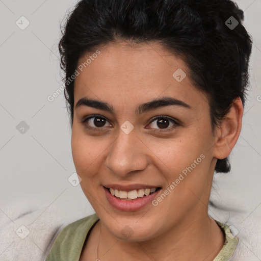 Joyful latino young-adult female with short  brown hair and brown eyes