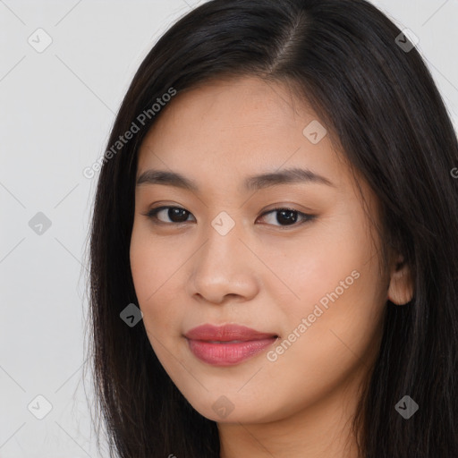 Joyful asian young-adult female with long  brown hair and brown eyes