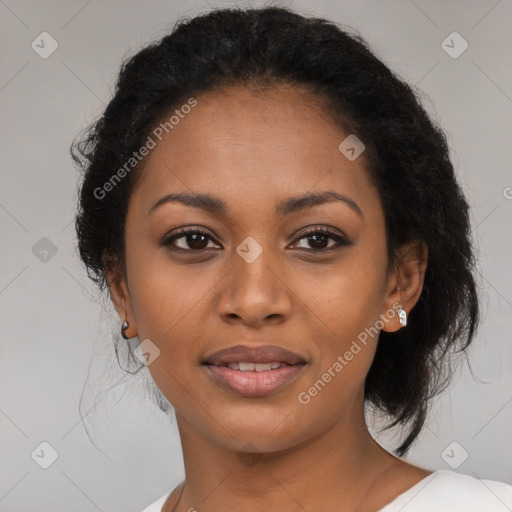 Joyful black young-adult female with medium  black hair and brown eyes