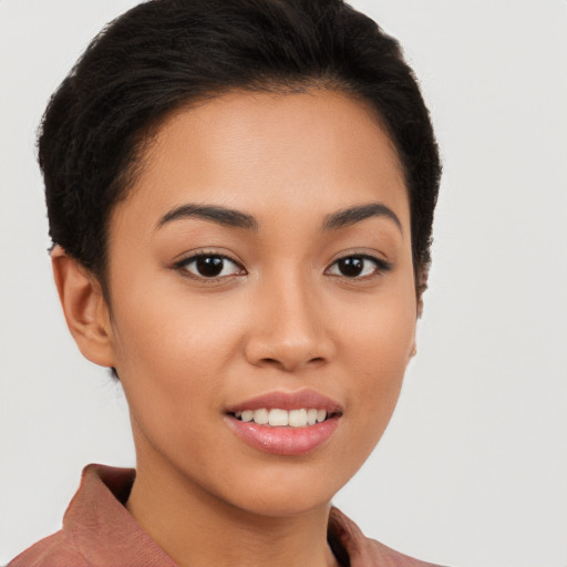 Joyful latino young-adult female with short  brown hair and brown eyes