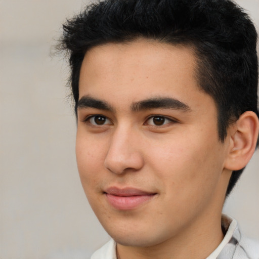 Joyful latino young-adult male with short  brown hair and brown eyes