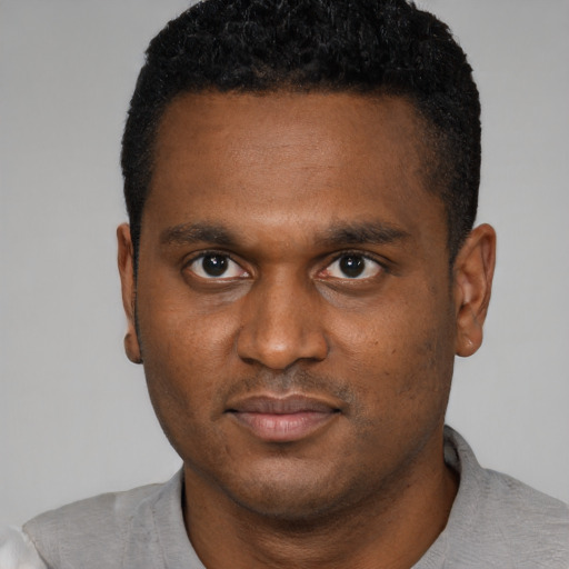 Neutral black young-adult male with short  brown hair and brown eyes