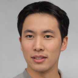 Neutral asian young-adult male with short  brown hair and brown eyes