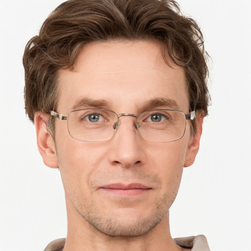 Joyful white adult male with short  brown hair and grey eyes