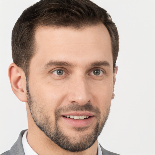 Joyful white young-adult male with short  brown hair and brown eyes