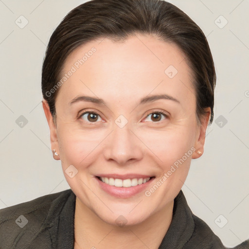 Joyful white adult female with short  brown hair and brown eyes