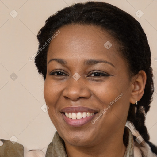 Joyful latino adult female with medium  brown hair and brown eyes