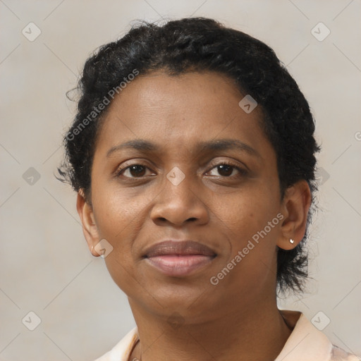 Joyful black adult female with short  brown hair and brown eyes