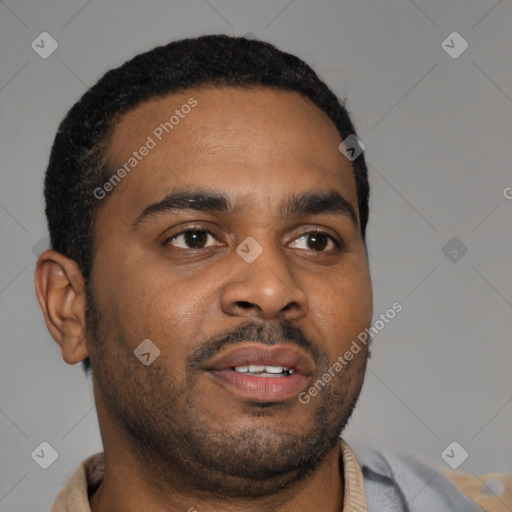 Joyful latino young-adult male with short  brown hair and brown eyes