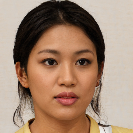 Neutral asian young-adult female with medium  brown hair and brown eyes