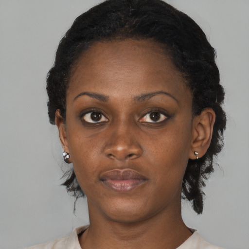 Neutral black young-adult female with medium  black hair and brown eyes