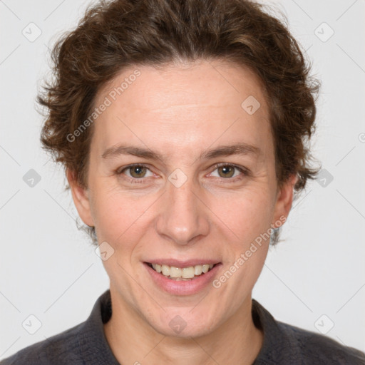 Joyful white adult female with short  brown hair and grey eyes