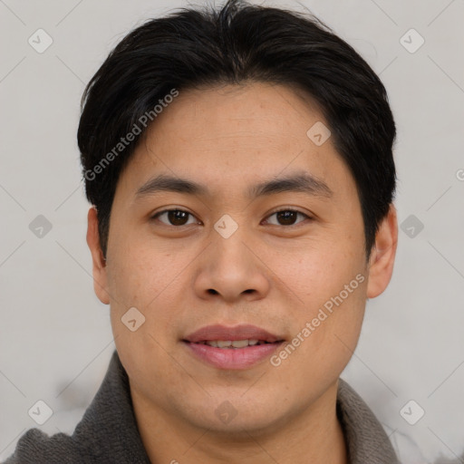 Joyful asian young-adult male with short  brown hair and brown eyes