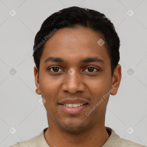 Joyful black young-adult male with short  black hair and brown eyes