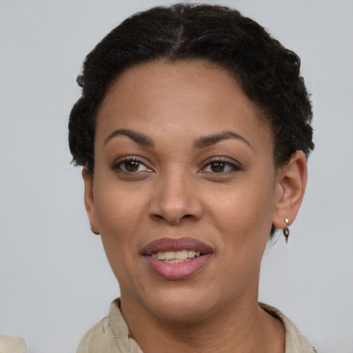 Joyful latino young-adult female with short  brown hair and brown eyes