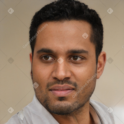 Joyful black young-adult male with short  black hair and brown eyes