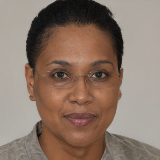 Joyful black adult female with short  brown hair and brown eyes