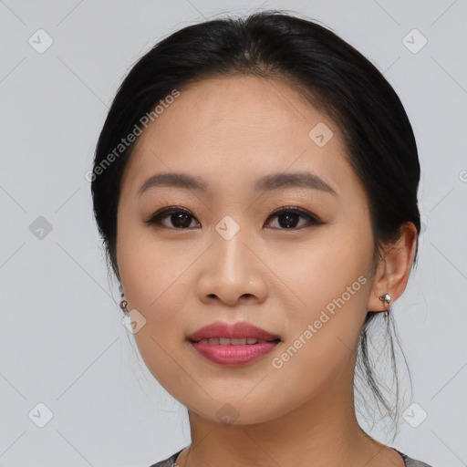 Joyful asian young-adult female with medium  black hair and brown eyes