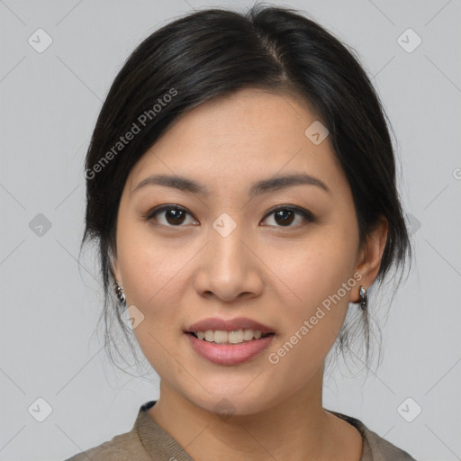 Joyful asian young-adult female with medium  black hair and brown eyes