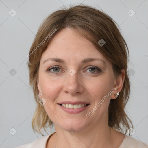 Joyful white young-adult female with medium  brown hair and grey eyes