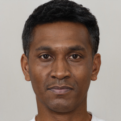 Neutral black adult male with short  black hair and brown eyes