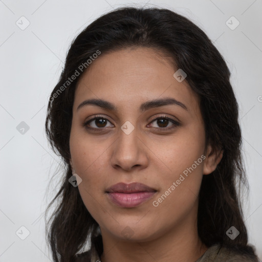 Joyful latino young-adult female with long  brown hair and brown eyes