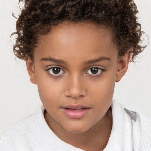 Joyful white child female with short  brown hair and brown eyes