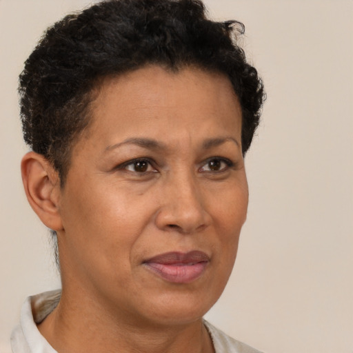 Joyful latino adult female with short  brown hair and brown eyes
