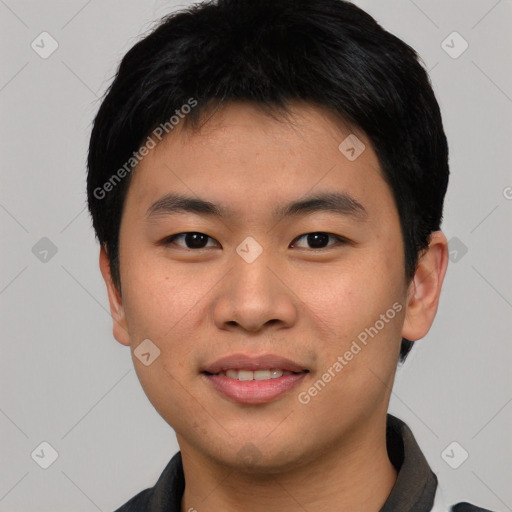 Joyful asian young-adult male with short  black hair and brown eyes