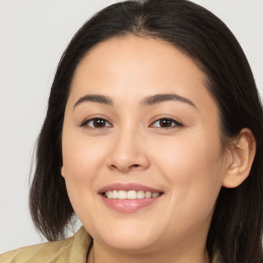 Joyful white young-adult female with long  brown hair and brown eyes